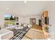 Bright living room with hardwood floors, a large window, modern decor, and ample natural light at 12682 Anhawa Ave, Longmont, CO 80503