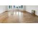 Inviting living room filled with natural light offers a clean, modern aesthetic and warm hardwood flooring at 12682 Anhawa Ave, Longmont, CO 80503