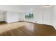 Spacious living room featuring hardwood floors and a large window offering natural light at 12682 Anhawa Ave, Longmont, CO 80503