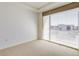 Well-lit bedroom featuring a large window and city view at 2001 Lincoln St # 1024, Denver, CO 80202