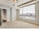 Spacious bedroom with large window and city views at 2001 Lincoln St # 1024, Denver, CO 80202