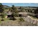 Scenic view features a home nestled among trees with a backdrop of rolling hills and blue skies at 18170 Forest View Rd, Monument, CO 80132