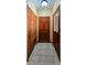 Hallway with tiled floor and closet provides convenient storage space and entryway access at 18170 Forest View Rd, Monument, CO 80132