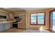 Bright kitchen featuring gray cabinets, stainless steel appliances, and hardwood floors at 18170 Forest View Rd, Monument, CO 80132