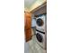 Convenient laundry closet equipped with a stacked washer and dryer at 18170 Forest View Rd, Monument, CO 80132
