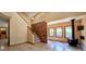 View of living area with brick accent wall and wood burning stove at 18170 Forest View Rd, Monument, CO 80132