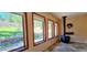 Bright living area featuring a wood burning stove and scenic outdoor views at 18170 Forest View Rd, Monument, CO 80132