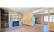 Inviting living room featuring a stone fireplace and hardwood floors at 18170 Forest View Rd, Monument, CO 80132