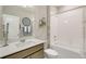 Well-lit bathroom featuring a combined shower and tub, complemented by a neutral color palette and modern fixtures at 16113 Alpine Sorrel Dr, Monument, CO 80132