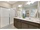 Bathroom with dual sink vanity, walk-in shower, and modern fixtures at 16113 Alpine Sorrel Dr, Monument, CO 80132