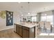 Spacious kitchen island with sink and seating, perfect for entertaining and dining at 16113 Alpine Sorrel Dr, Monument, CO 80132