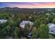 Aerial view of a stunning home nestled among trees, showcasing its serene and private setting at 237 Lead King Dr, Castle Rock, CO 80108