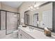 Well-lit bathroom features a glass-enclosed shower and a vanity with ample counter space at 237 Lead King Dr, Castle Rock, CO 80108