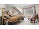 Cozy bedroom with brass bed frame and rocking chair at 237 Lead King Dr, Castle Rock, CO 80108