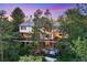 Stunning multi-level home with spacious decks and a private hot tub nestled amongst mature trees at 237 Lead King Dr, Castle Rock, CO 80108