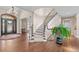 Grand foyer featuring a curved staircase, hardwood floors, and a stylish entryway with natural light at 237 Lead King Dr, Castle Rock, CO 80108