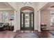 Elegant foyer with hardwood floors, arched doorway, decorative rug, and sophisticated accents at 237 Lead King Dr, Castle Rock, CO 80108