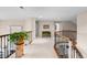 Upstairs hallway featuring nice railing, bench, and neutral carpet at 237 Lead King Dr, Castle Rock, CO 80108