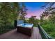 Inviting hot tub on a private deck surrounded by lush greenery, perfect for relaxation at 237 Lead King Dr, Castle Rock, CO 80108
