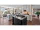 Bright kitchen features an island with a stovetop and a large window for plenty of natural light at 237 Lead King Dr, Castle Rock, CO 80108