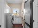 Functional laundry room with modern appliances, a sink, and ample storage at 237 Lead King Dr, Castle Rock, CO 80108