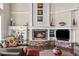 Inviting living room showcasing a stone fireplace, custom built-ins, and comfortable seating arrangement at 237 Lead King Dr, Castle Rock, CO 80108