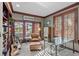 Cozy office space with a bookshelf, a glass table, and views of the outside patio at 237 Lead King Dr, Castle Rock, CO 80108
