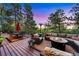 Spacious outdoor deck with a fire pit, comfortable seating, and a scenic view at 237 Lead King Dr, Castle Rock, CO 80108