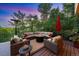 Inviting outdoor seating area with a fire pit and comfortable wicker furniture at 237 Lead King Dr, Castle Rock, CO 80108