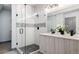 Elegant bathroom featuring a walk-in shower and double vanity at 2820 W 26Th Ave # 101, Denver, CO 80211