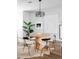 Modern dining area with round table and unique chairs at 2820 W 26Th Ave # 101, Denver, CO 80211