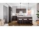 Modern kitchen with dark cabinetry and an island at 2820 W 26Th Ave # 101, Denver, CO 80211