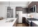 Clean kitchen with stainless steel appliances and island at 2820 W 26Th Ave # 101, Denver, CO 80211