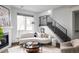Stylish living room with a curved sofa and modern decor at 2820 W 26Th Ave # 101, Denver, CO 80211