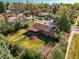 Aerial view showcases the property's spacious backyard, mature trees, and charming neighborhood setting at 3061 S Mabry Ct, Denver, CO 80236