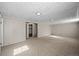 Spacious basement with carpet flooring and unique tiled ceiling at 3061 S Mabry Ct, Denver, CO 80236