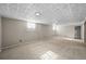 Basement featuring carpet flooring, neutral paint, and windows at 3061 S Mabry Ct, Denver, CO 80236