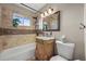 Bathroom featuring a vanity with granite counters and mosaic tile accents at 3061 S Mabry Ct, Denver, CO 80236