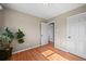 Bedroom featuring hardwood floors, neutral paint, and a closet at 3061 S Mabry Ct, Denver, CO 80236
