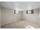 Carpeted bedroom with white walls, baseboard heating, and two windows with coverings at 3061 S Mabry Ct, Denver, CO 80236
