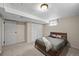 Cozy bedroom features neutral tones, carpet, closet, and natural light from the basement window at 3061 S Mabry Ct, Denver, CO 80236