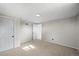 Large bedroom with carpet provides comfort, with two doors allowing for multiple uses at 3061 S Mabry Ct, Denver, CO 80236