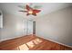 Bedroom featuring hardwood floors, a ceiling fan, and a closet at 3061 S Mabry Ct, Denver, CO 80236