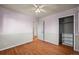 Bedroom featuring hardwood floors, neutral paint, and a closet at 3061 S Mabry Ct, Denver, CO 80236