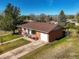 Well-maintained brick ranch with a manicured lawn and a welcoming front yard at 3061 S Mabry Ct, Denver, CO 80236