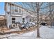 Backyard with a patio and a house covered in light blue siding in winter at 6210 Wescroft Ave, Castle Rock, CO 80104