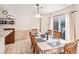 Cozy dining area with a wooden table, chairs, and a sliding door leading to outdoor space at 6210 Wescroft Ave, Castle Rock, CO 80104