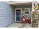 Charming front porch with stone accents, welcome mat, and cozy seating creates a warm entrance at 6210 Wescroft Ave, Castle Rock, CO 80104