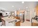 Modern kitchen with stainless steel appliances, breakfast bar, and an open layout to the living area at 6210 Wescroft Ave, Castle Rock, CO 80104