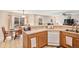 Open kitchen with updated counters and an adjacent dining area, perfect for entertaining guests at 6210 Wescroft Ave, Castle Rock, CO 80104